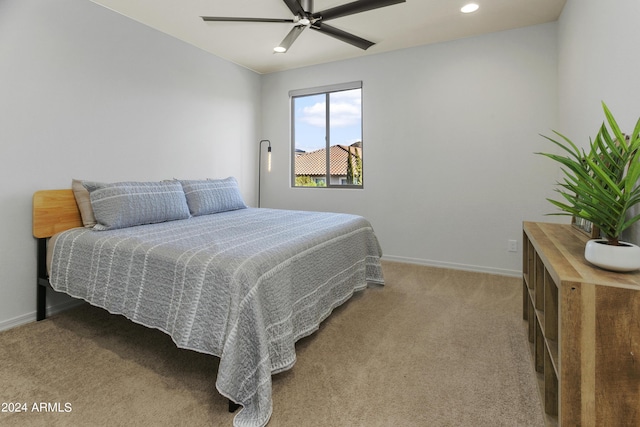 7180 W Tombstone Trl, Peoria, AZ 85383 - bedroom with light carpet, baseboards, recessed lighting, and a ceiling fan
