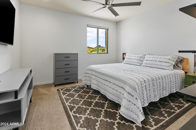 7180 W Tombstone Trl, Peoria, AZ 85383 - bedroom featuring light carpet, a ceiling fan, and baseboards