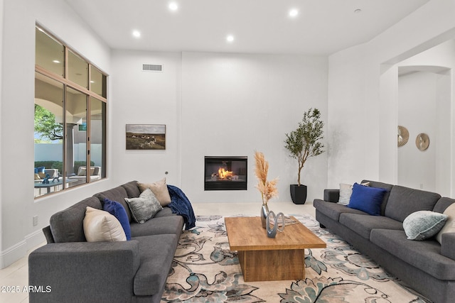 7775 E Fledgling Dr, Scottsdale, AZ 85255 - living room featuring recessed lighting and a glass covered fireplace