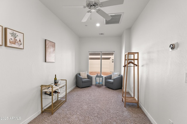 7775 E Fledgling Dr, Scottsdale, AZ 85255 - living area with carpet floors and ceiling fan