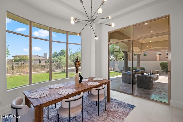 7775 E Fledgling Dr, Scottsdale, AZ 85255 - dining space featuring plenty of natural light, a chandelier, and decorative columns