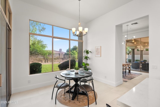 7775 E Fledgling Dr, Scottsdale, AZ 85255 - dining room featuring a chandelier and ornate columns