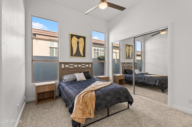 7775 E Fledgling Dr, Scottsdale, AZ 85255 - carpeted bedroom featuring multiple windows, a closet, and a ceiling fan