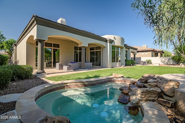 7775 E Fledgling Dr, Scottsdale, AZ 85255 - rear view of house with a patio, outdoor lounge area, a chimney, and stucco siding