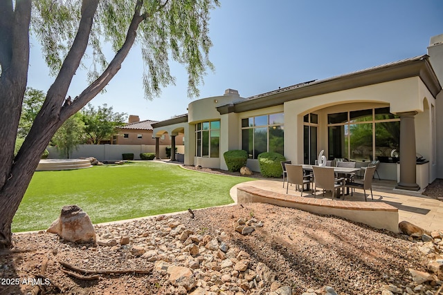 7775 E Fledgling Dr, Scottsdale, AZ 85255 - rear view of house featuring a patio and stucco siding
