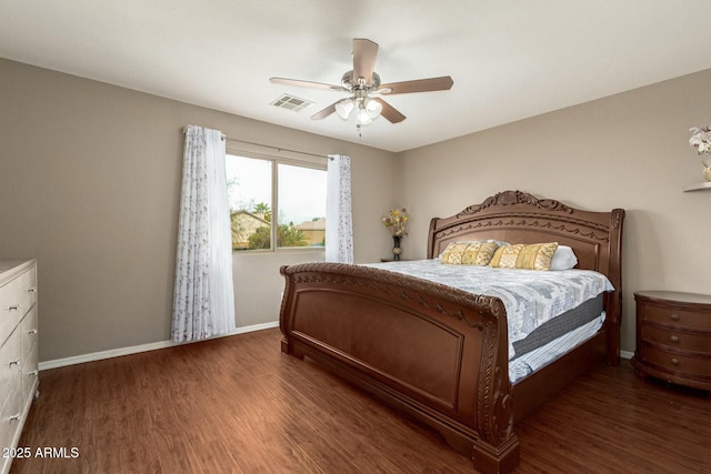 bedroom featuring baseboards, visible vents, ceiling fan, and dark wood-style flooring