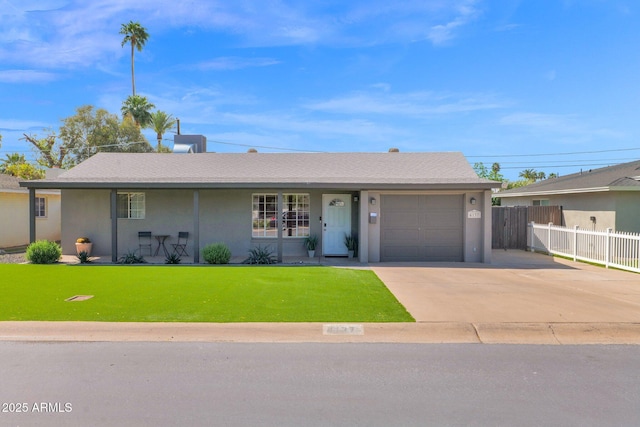 4137 E Sells Dr, Phoenix, AZ 85018 - ranch-style house with a garage, driveway, and stucco siding