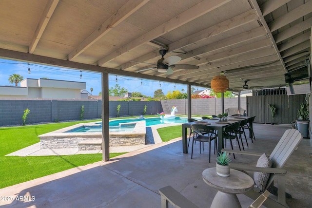 4137 E Sells Dr, Phoenix, AZ 85018 - fenced backyard with a ceiling fan, a patio, and outdoor dining area