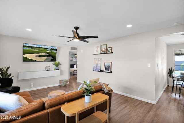 4137 E Sells Dr, Phoenix, AZ 85018 - living room with wood finished floors, ceiling fan, recessed lighting, and baseboards