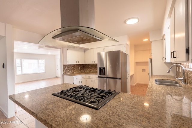 kitchen with sink, white cabinetry, stainless steel appliances, island exhaust hood, and kitchen peninsula