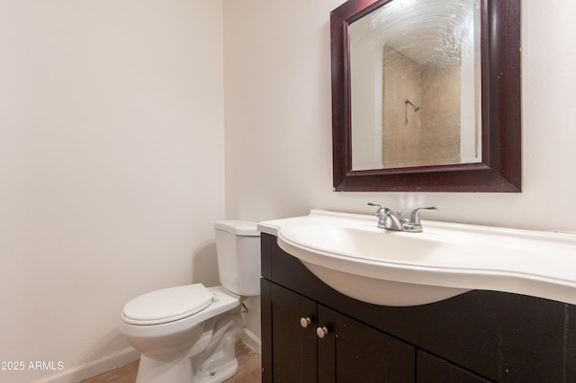 bathroom with vanity, tile patterned floors, and toilet