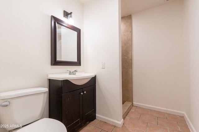 bathroom with tile patterned flooring, a shower, vanity, and toilet