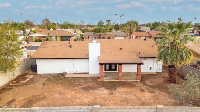 rear view of house with a patio area and central air condition unit