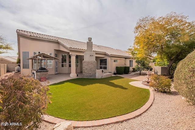 back of house with a yard and a patio area