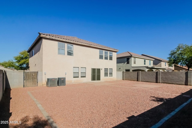 back of property with central AC unit