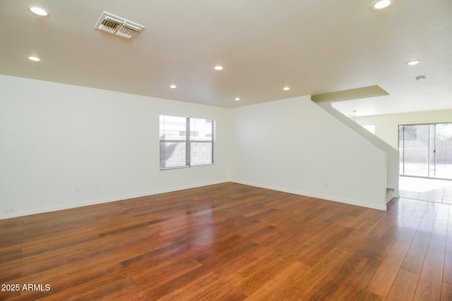 empty room featuring wood-type flooring