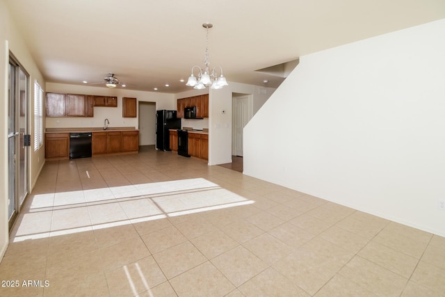 kitchen with black appliances, ceiling fan with notable chandelier, sink, hanging light fixtures, and light tile patterned floors