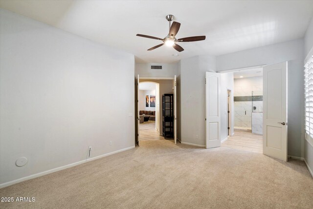7979 E Princess Dr Unit 13, Scottsdale, AZ 85255 - living area featuring arched walkways, light wood finished floors, and recessed lighting