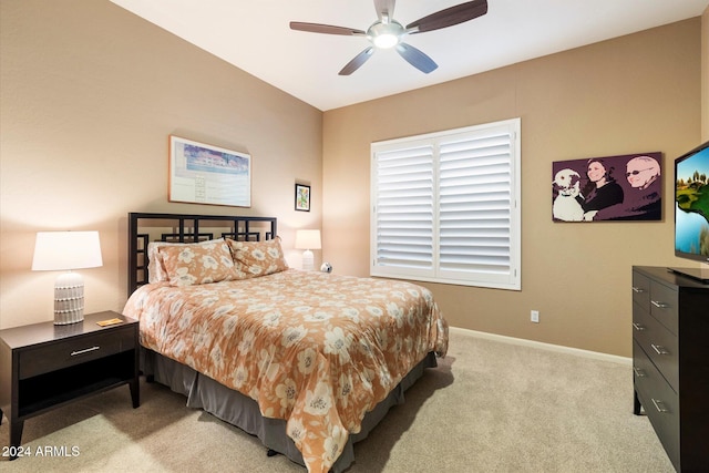 bedroom with light carpet and ceiling fan