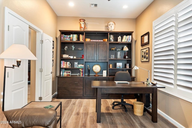 office space with light wood-type flooring