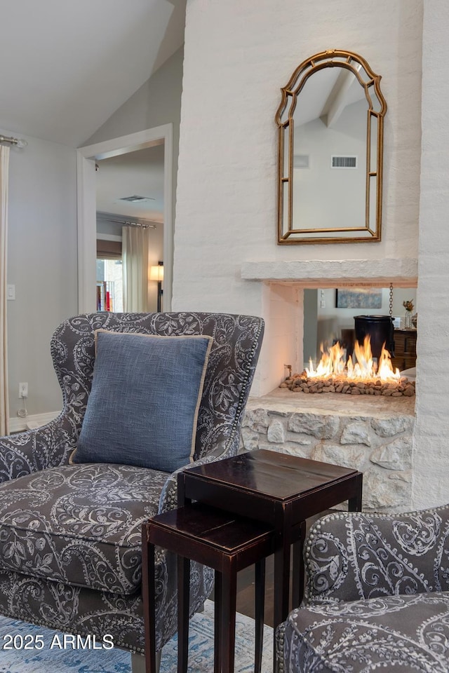 living area with vaulted ceiling