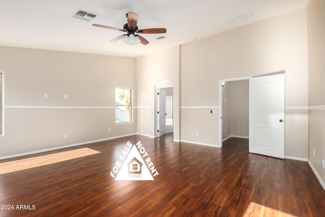 unfurnished room featuring ceiling fan and dark hardwood / wood-style flooring