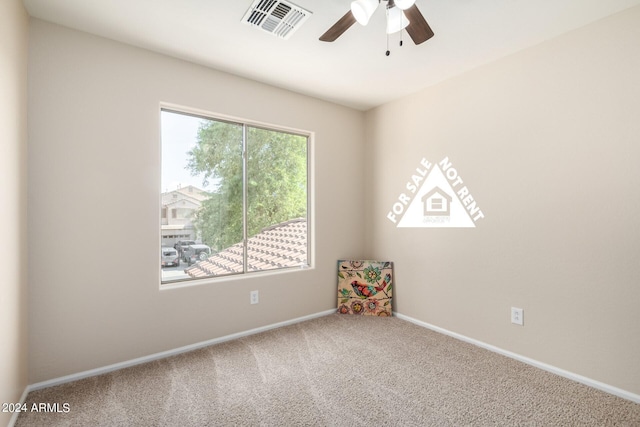 carpeted empty room with ceiling fan