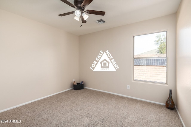 empty room featuring carpet flooring and ceiling fan