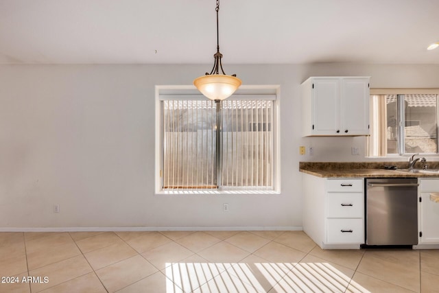 kitchen featuring pendant lighting, dishwasher, sink, light tile patterned floors, and white cabinetry