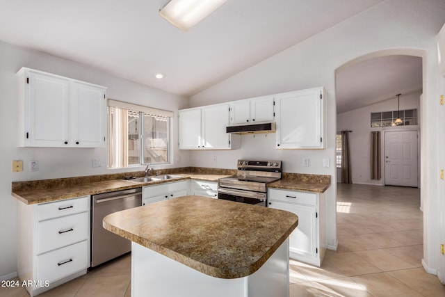 kitchen featuring a center island, lofted ceiling, white cabinets, sink, and stainless steel appliances