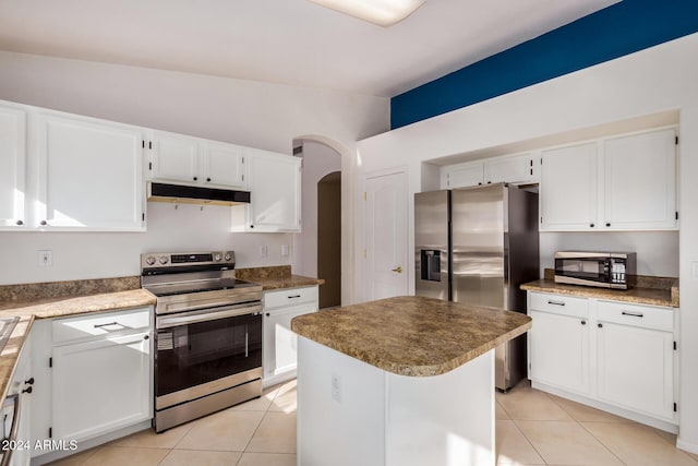 kitchen with white cabinets, a center island, and stainless steel appliances