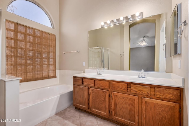 bathroom with tile patterned flooring, ceiling fan, shower with separate bathtub, and vanity