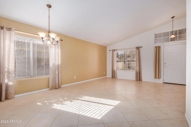 unfurnished room featuring a chandelier, light tile patterned floors, and vaulted ceiling