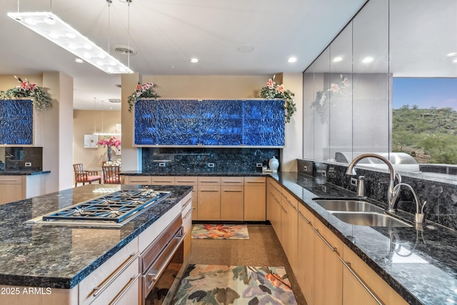 39602 N Charles Blair Macdonald Rd, Scottsdale, AZ 85262 - kitchen with stainless steel gas cooktop, backsplash, a warming drawer, recessed lighting, and dark stone counters