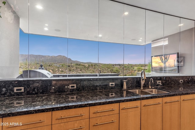 39602 N Charles Blair Macdonald Rd, Scottsdale, AZ 85262 - kitchen with dark stone countertops, backsplash, a mountain view, modern cabinets, and recessed lighting