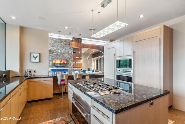 39602 N Charles Blair Macdonald Rd, Scottsdale, AZ 85262 - kitchen featuring stainless steel appliances, dark stone counters, pendant lighting, a kitchen island, and recessed lighting