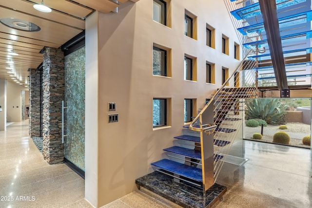 39602 N Charles Blair Macdonald Rd, Scottsdale, AZ 85262 - stairway with speckled floor and a high ceiling