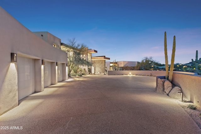 39602 N Charles Blair Macdonald Rd, Scottsdale, AZ 85262 - view of asphalt road featuring community garages