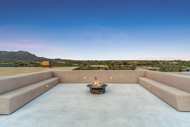 39602 N Charles Blair Macdonald Rd, Scottsdale, AZ 85262 - view of patio featuring a fire pit and a mountain view