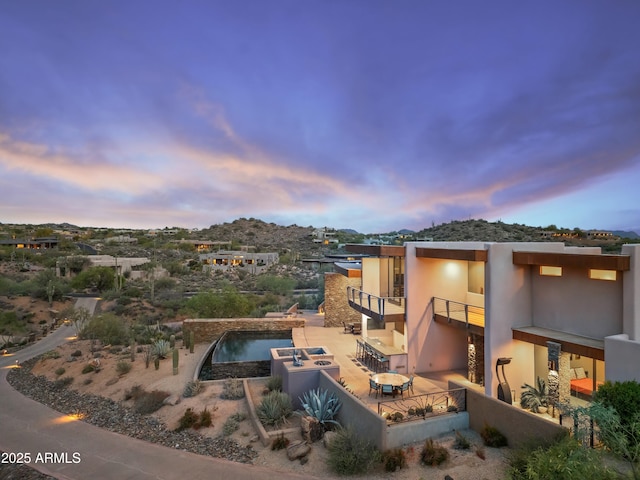 39602 N Charles Blair Macdonald Rd, Scottsdale, AZ 85262 - exterior space with a patio area, stucco siding, a balcony, a mountain view, and an infinity pool