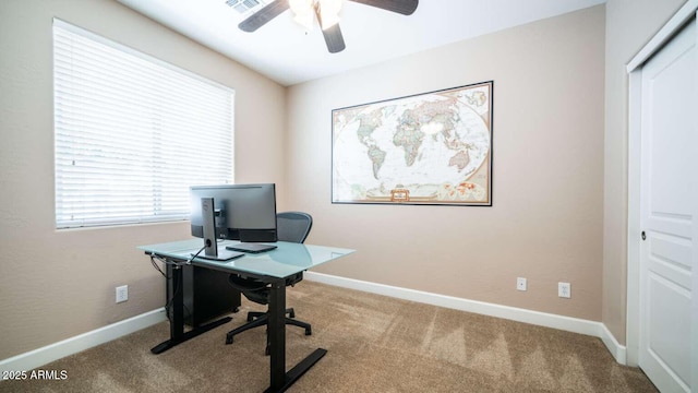 carpeted office with ceiling fan