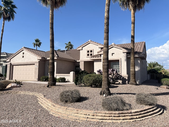 15314 W Camino Estrella Dr, Surprise, AZ 85374 - view of front of home featuring stucco siding, an attached garage, a tile roof, and concrete driveway