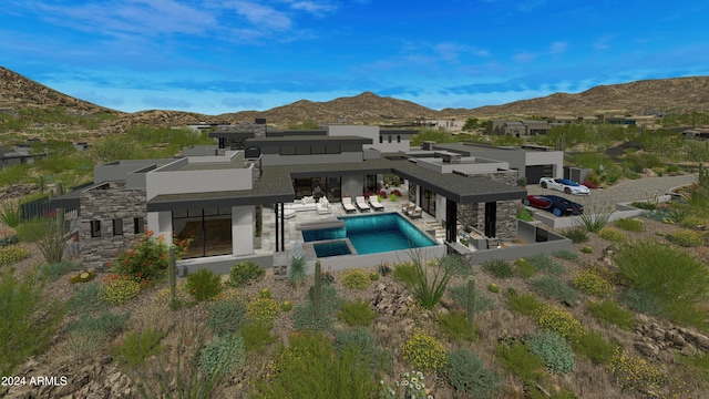 rear view of property with a mountain view, a jacuzzi, and a patio