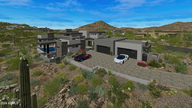 exterior space featuring a garage and a mountain view