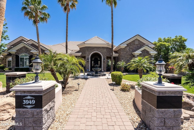 view of front of home featuring stone siding