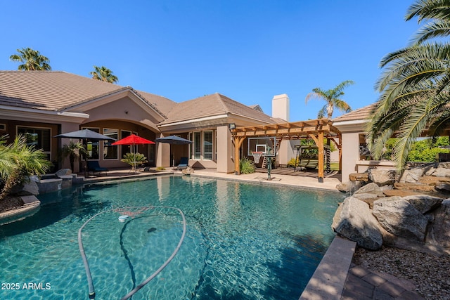 pool featuring a patio and a pergola