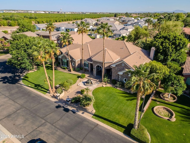 birds eye view of property with a residential view