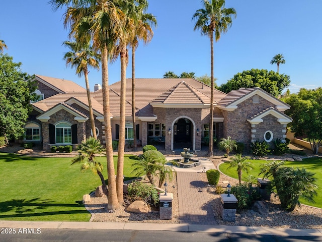 3949 E Norcroft Cir, Mesa, AZ 85215 - view of front facade with a tiled roof, a front yard, and stone siding
