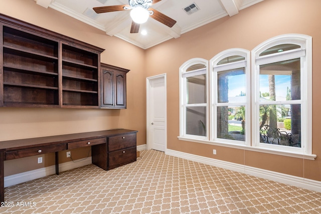 unfurnished office featuring built in desk, visible vents, beamed ceiling, ceiling fan, and light carpet