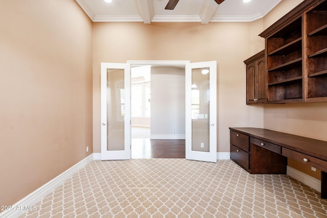 unfurnished office with crown molding, french doors, and baseboards
